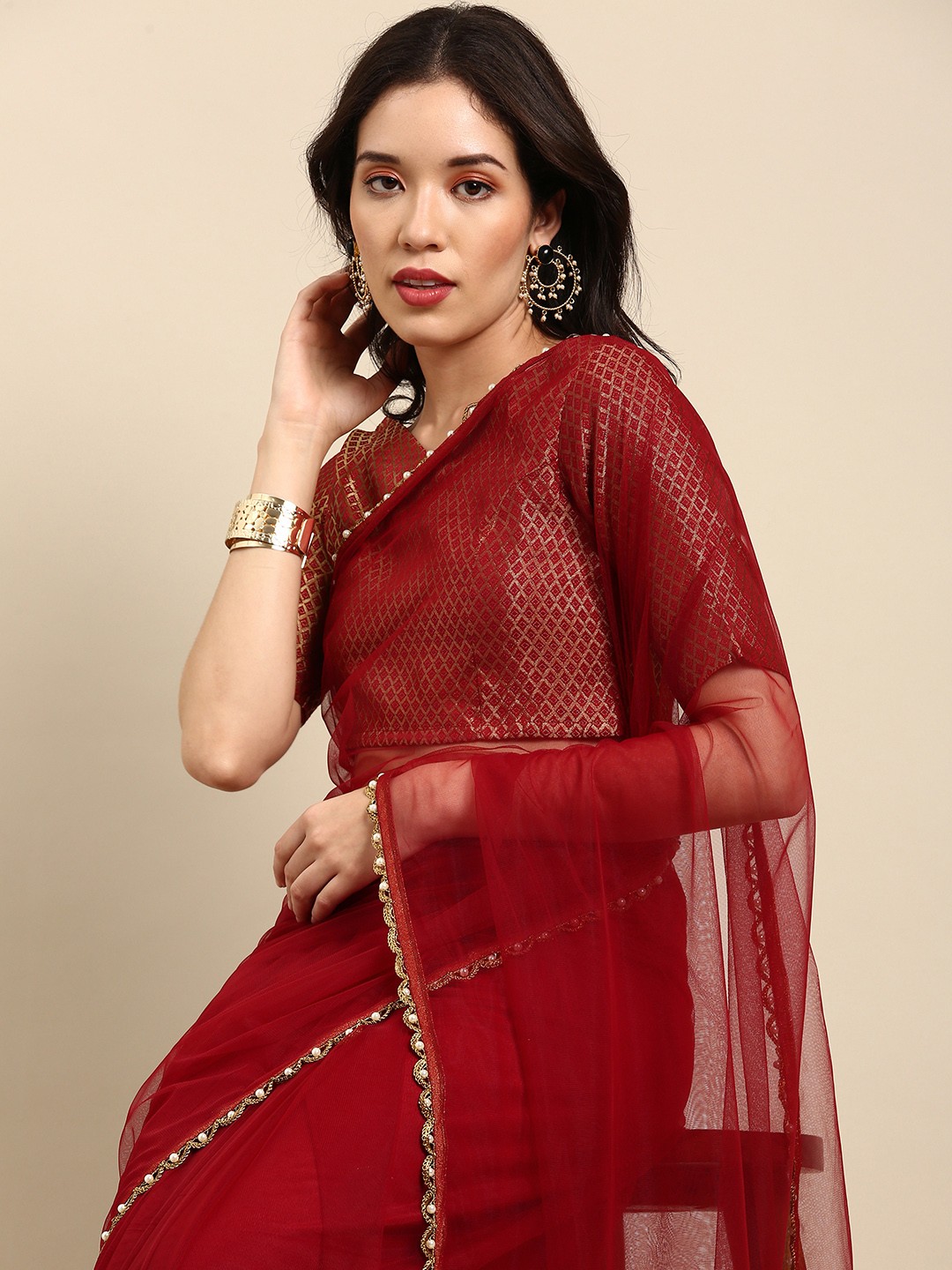 

Sangria Maroon Beads and Stones Net Saree
