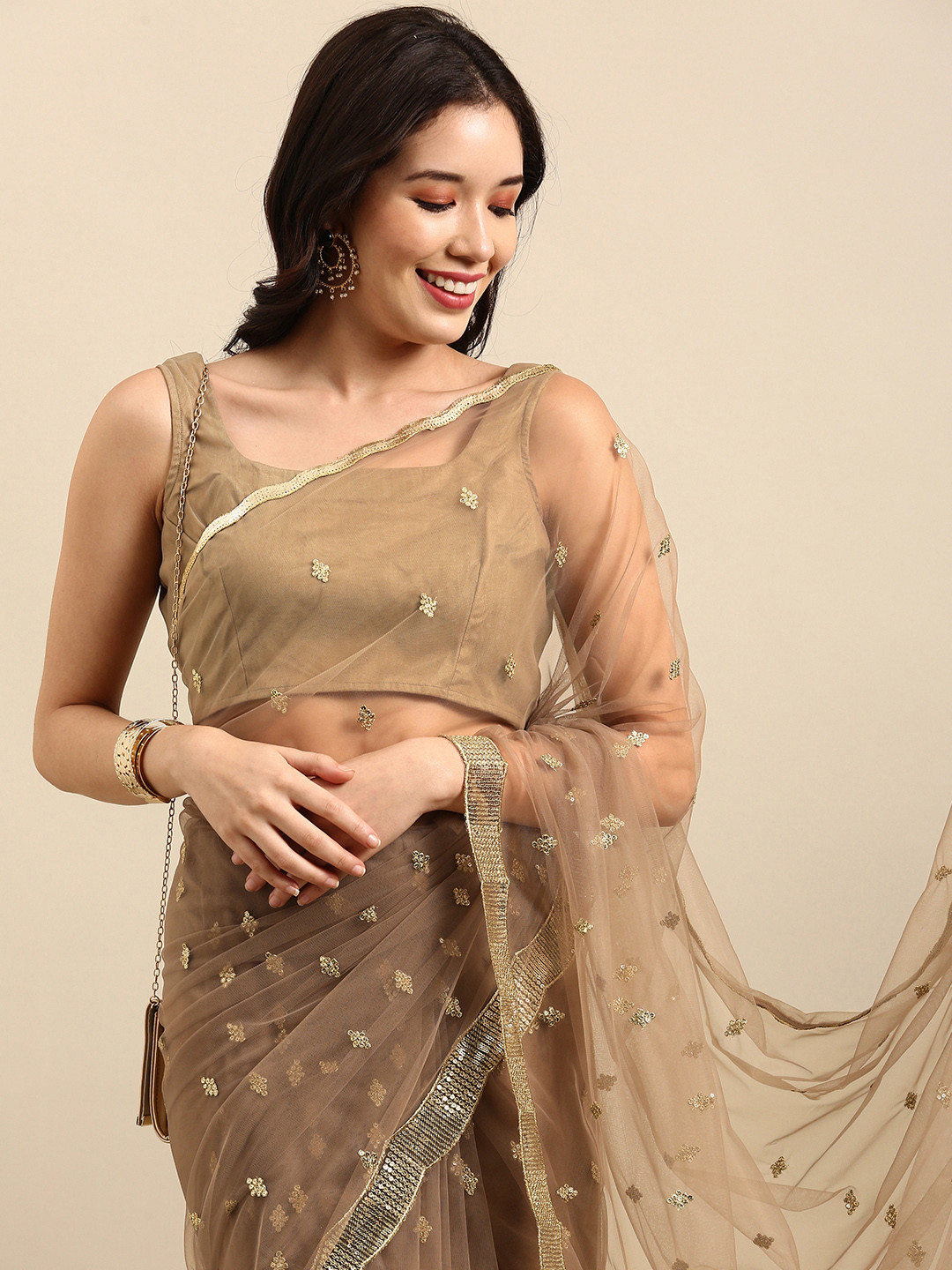 

Sangria Taupe Ethnic Motifs Sequinned Net Saree