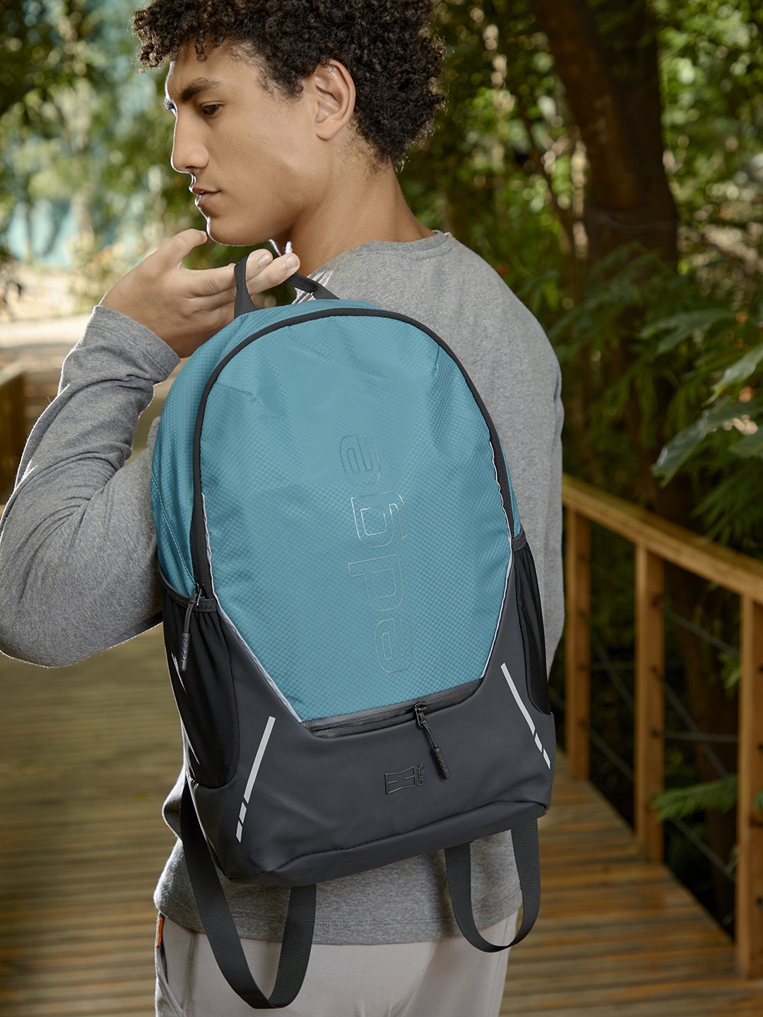 

HRX by Hrithik Roshan Unisex Turquoise Blue & Black Typography Backpack with Reflective Strip