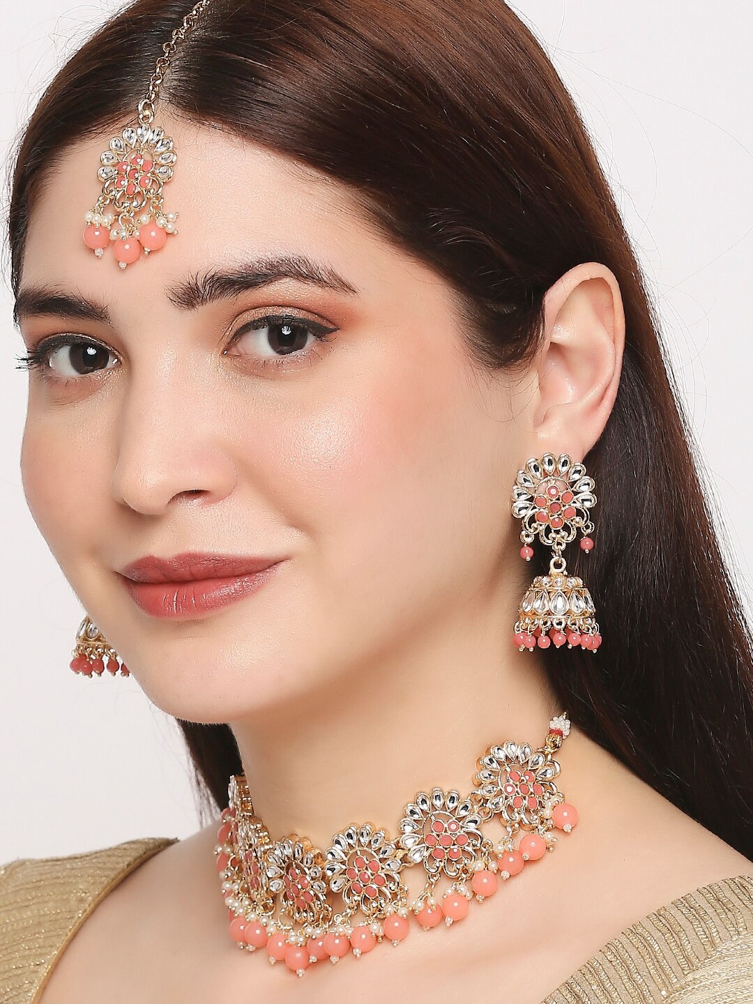 

OOMPH Gold-Toned & Peach-Coloured Kundan-Studded & Beaded Jadau Jewellery Set