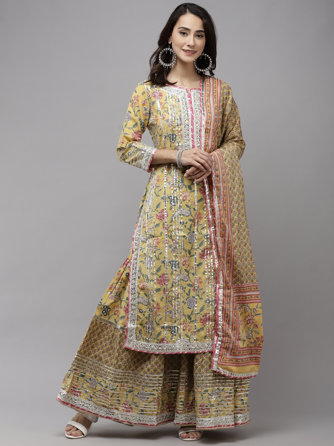 

Ishin Women Yellow Floral Embroidered Regular Gotta Patti Pure Cotton Kurta with Sharara & With Dupatta