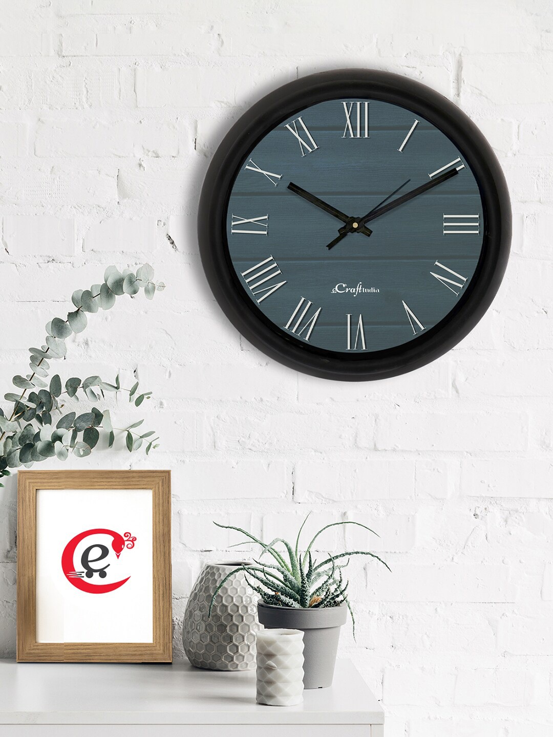 

eCraftIndia Blue & Black Printed Contemporary Analogue Wall Clock