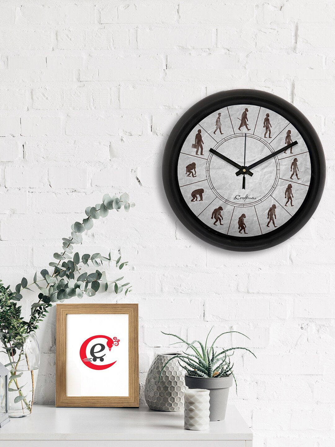

eCraftIndia Grey & Black Man Evolution Printed Contemporary Analogue Wall Clock