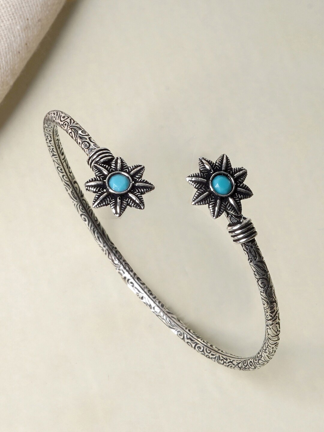 

TEEJH Silver-Plated Blue Stone Studded Oxidised Floral Bracelet