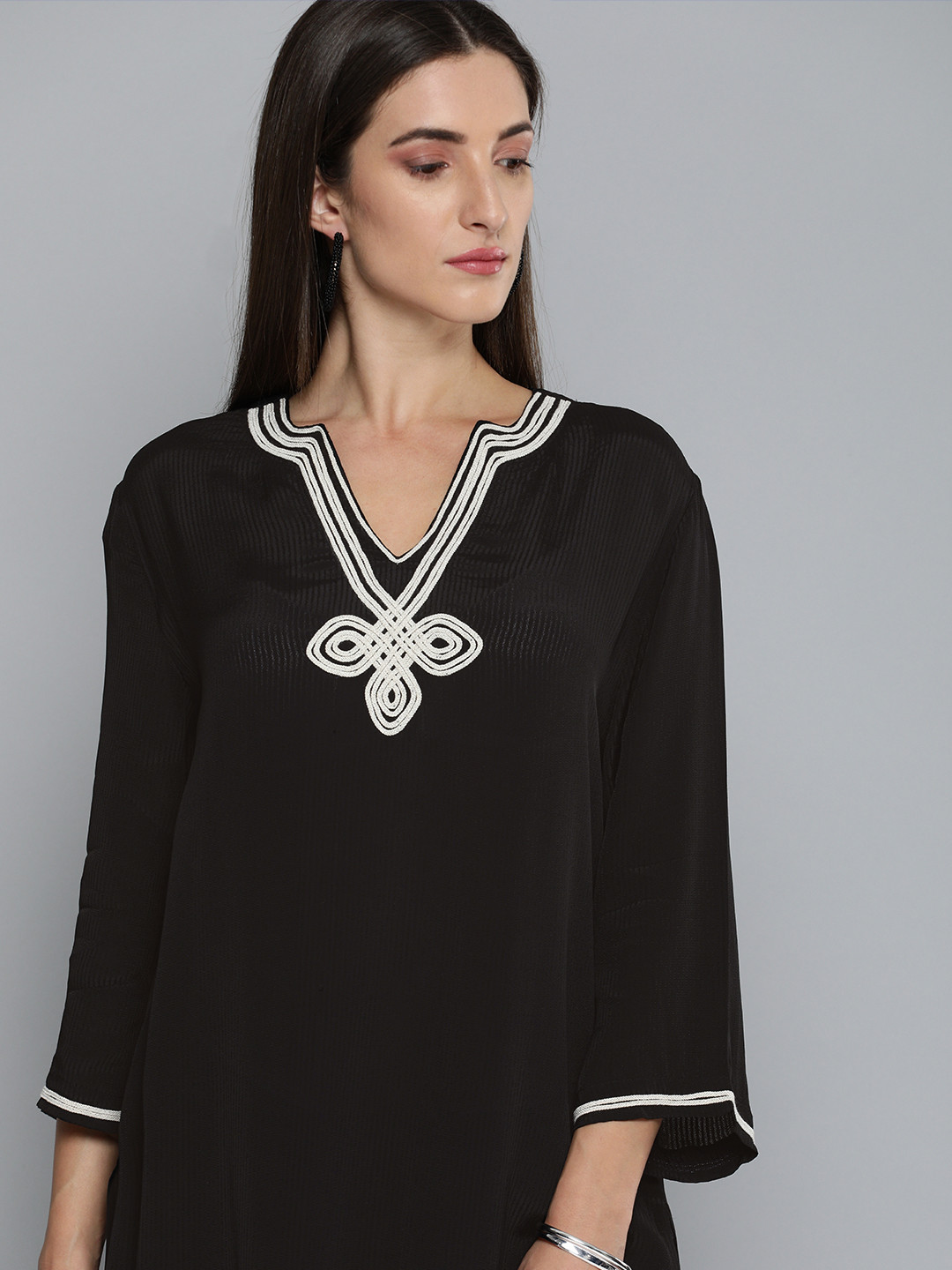 

Modern Indian by CHEMISTRY Women Black Printed Regular Kurta with Palazzos