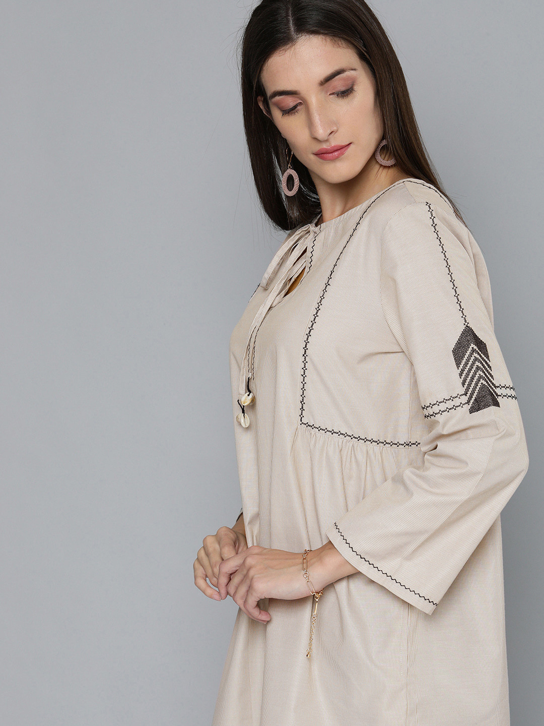

Modern Indian by CHEMISTRY Women Beige Striped Flared Sleeves Kurta