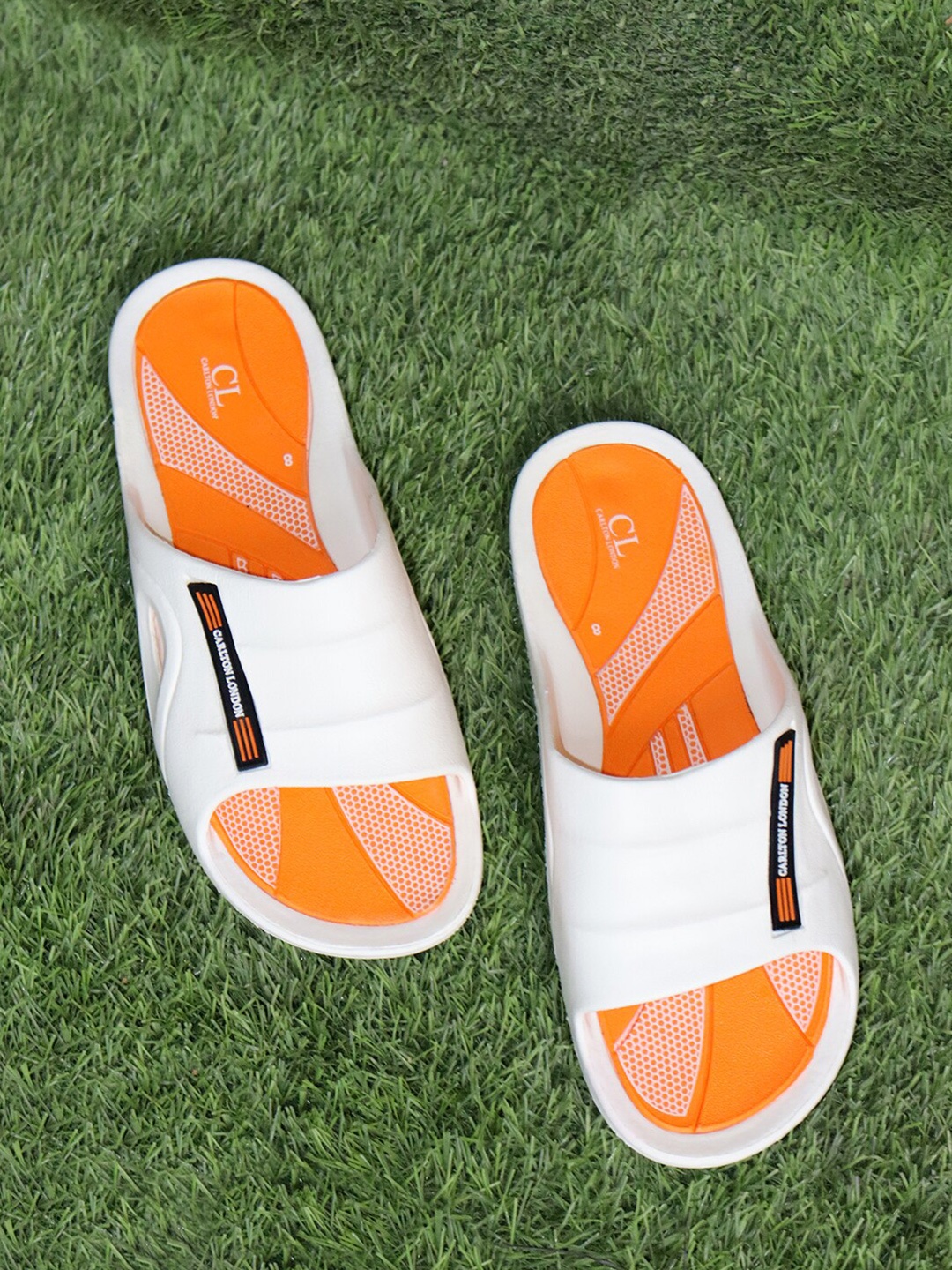 

Carlton London Men White & Orange Solid Sliders