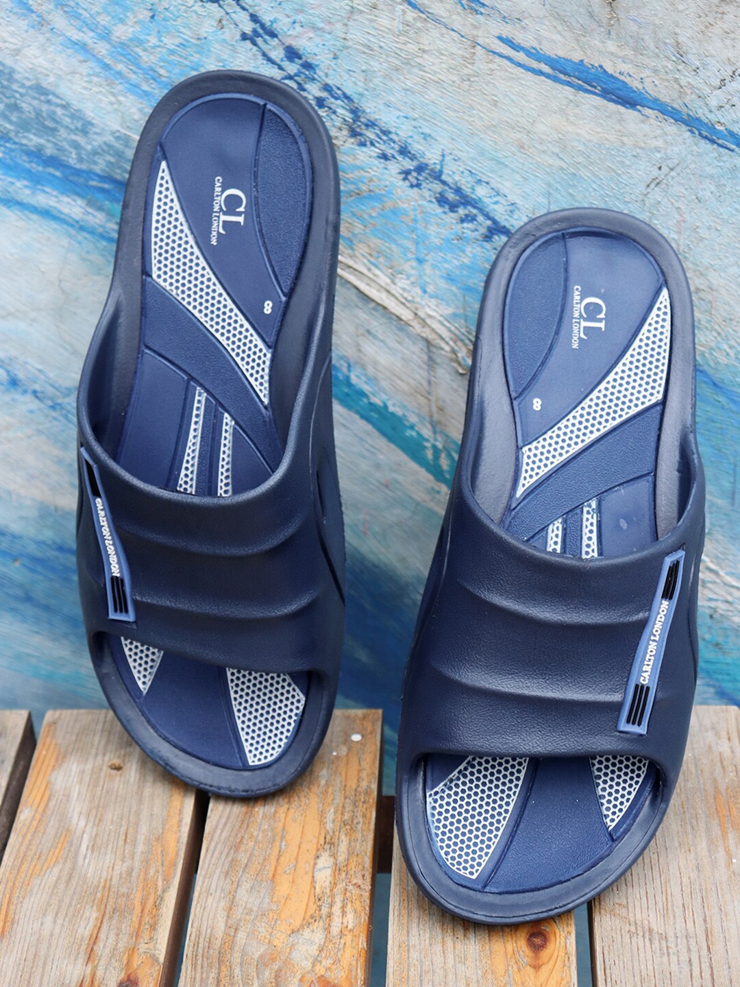 

Carlton London Men Navy Blue & White Solid Sliders