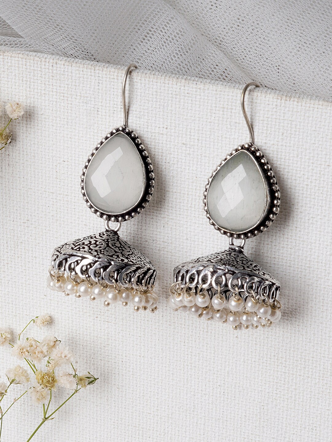 

TEEJH Silver-Plated & White Contemporary Jhumkas Earrings