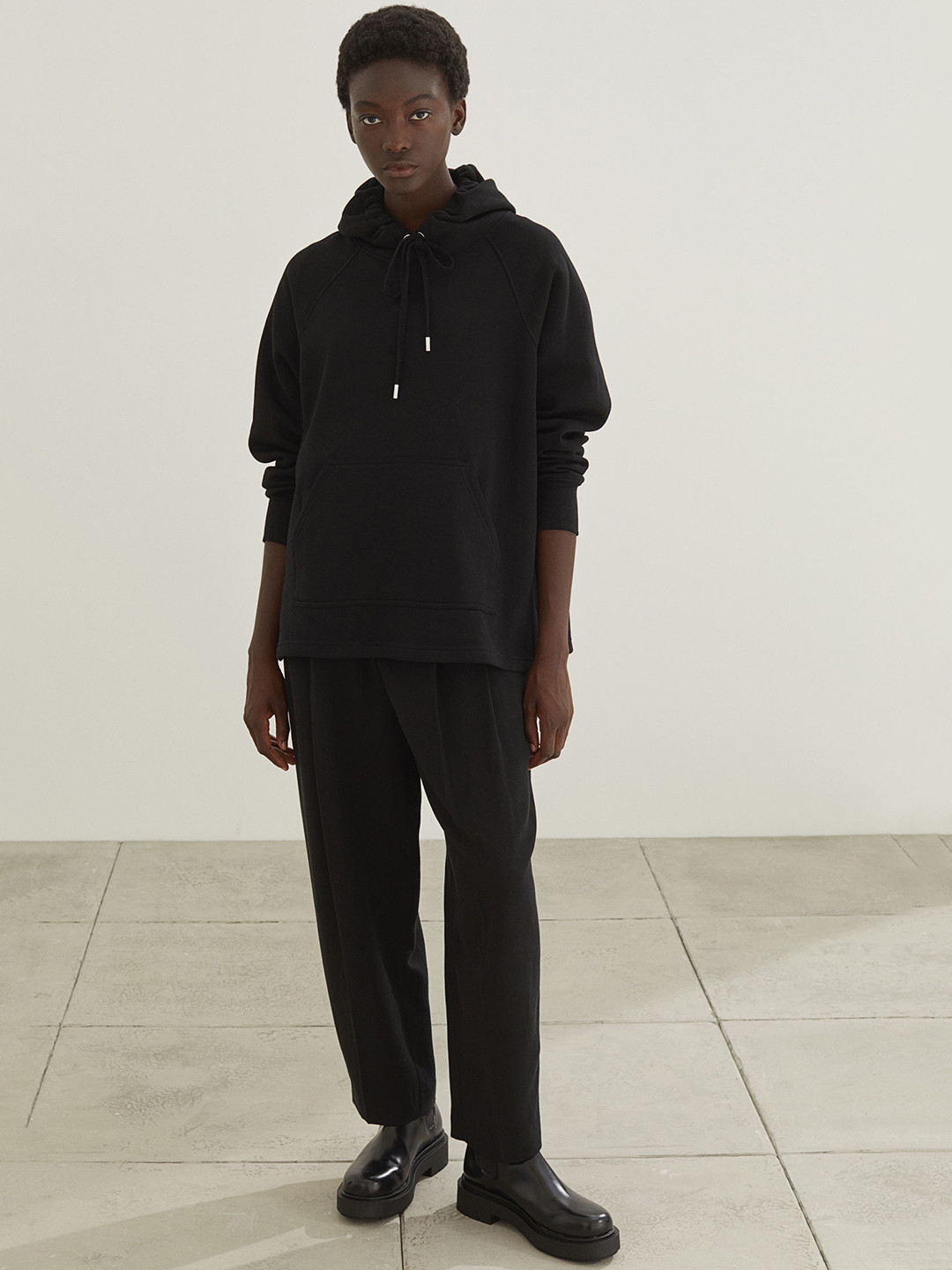 

H&M Women Black Solid Hoodie