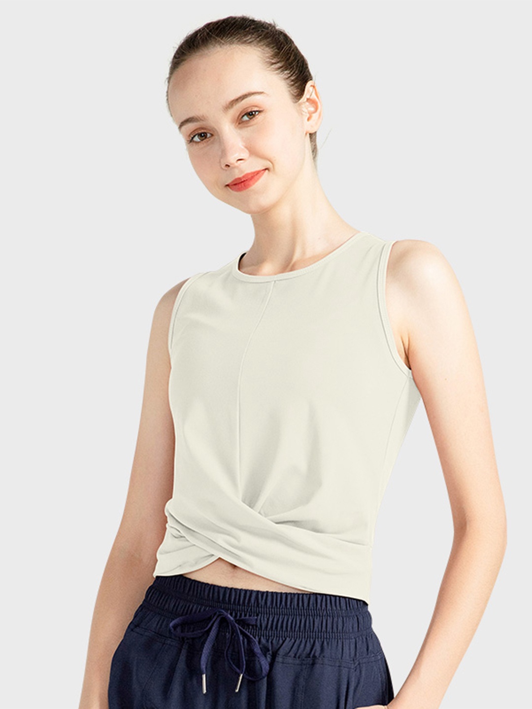 

URBANIC Beige Solid Regular Crop Twisted Top