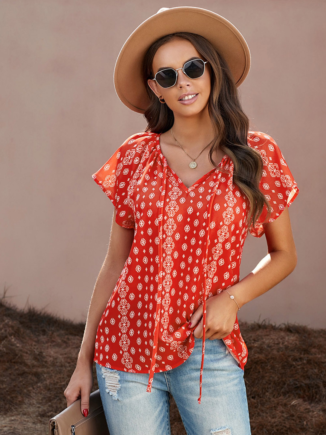 

URBANIC Women Orange & White Printed Tie-Up Neck Top