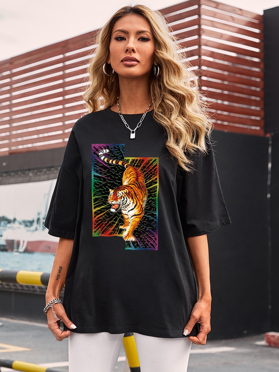 

URBANIC Women Black & Orange Printed Extended Sleeves T-shirt