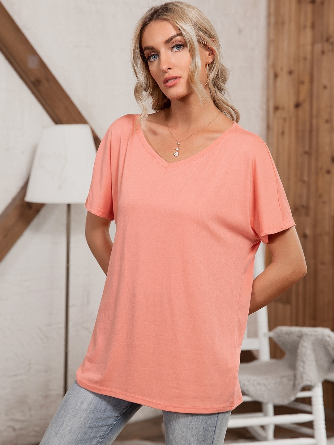 

URBANIC Women Peach-Coloured Solid Relaxed Fit Longline T-shirt