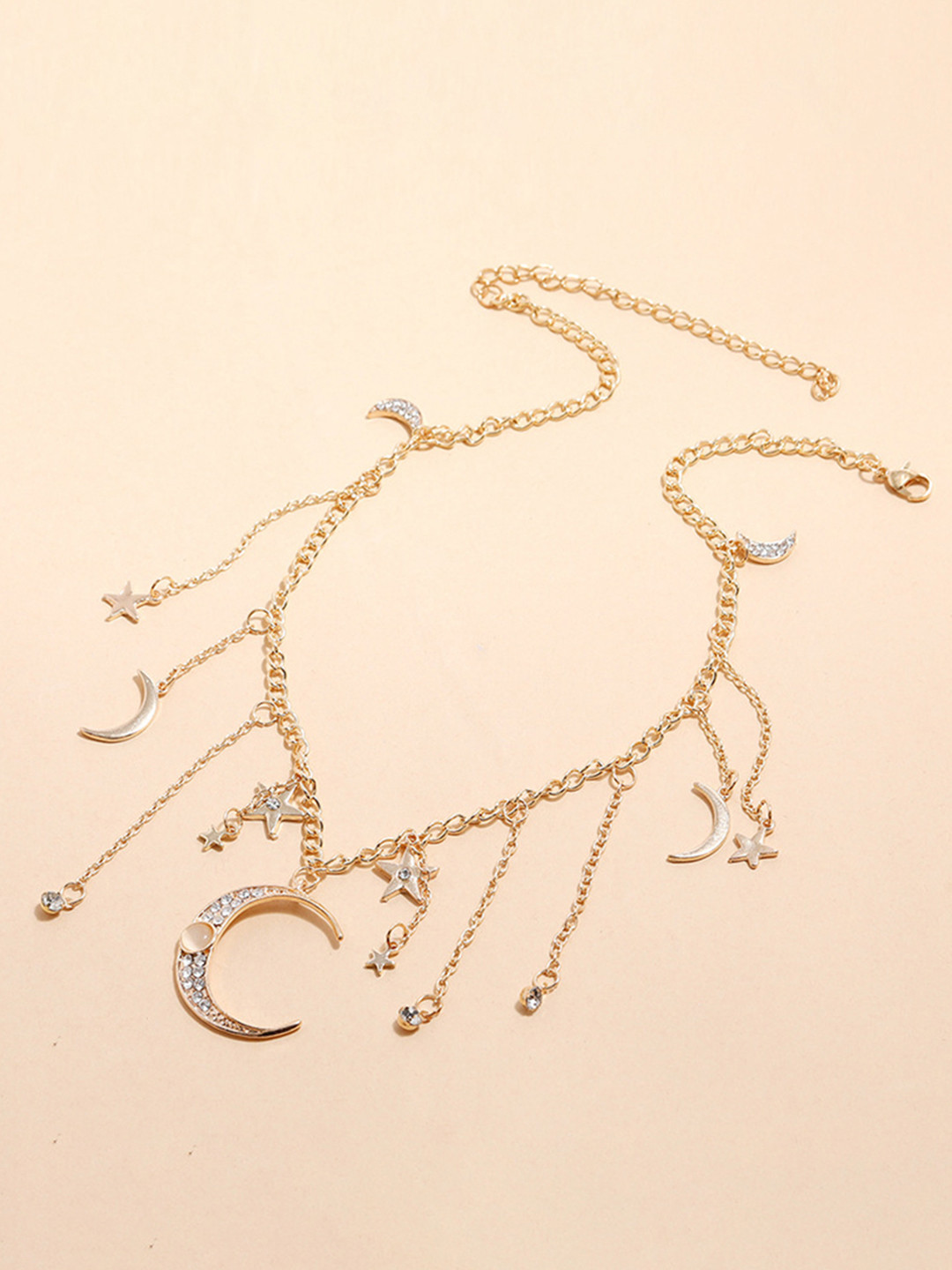 

URBANIC Gold-Toned Stone Studded Moon & Star Tasselled Link Necklace