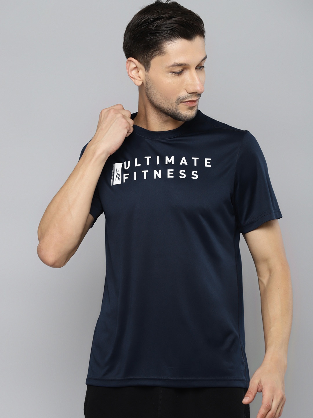

Reebok Men Navy Blue & White Typography Printed Speedwick T-shirt