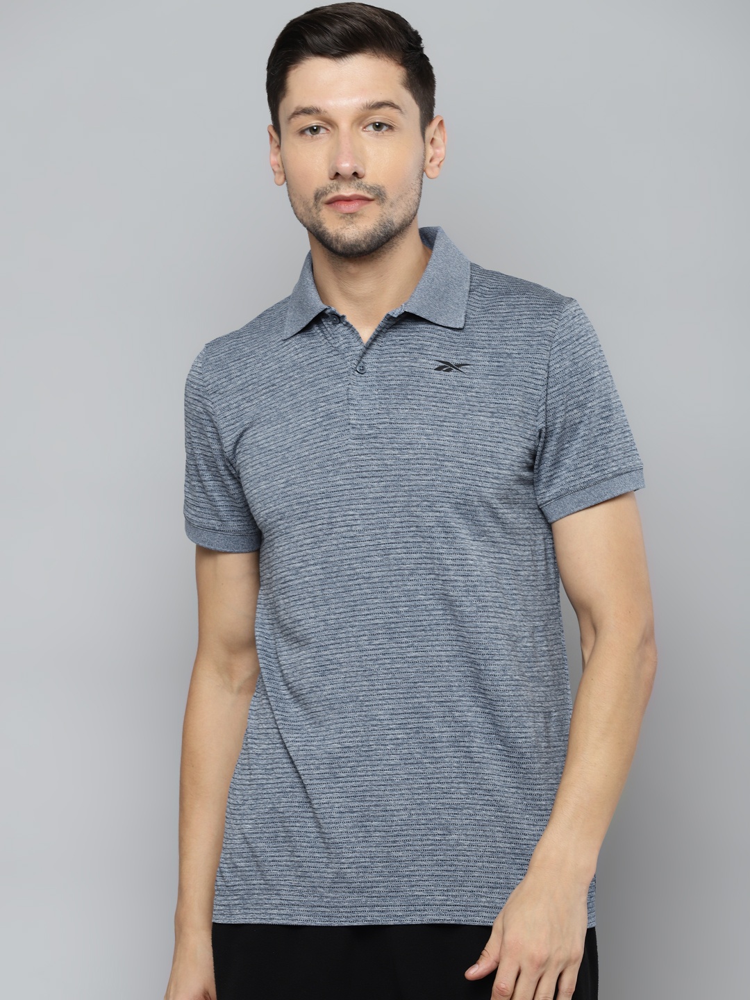 

Reebok Men Blue Solid Polo Collar Speedwick T-shirt
