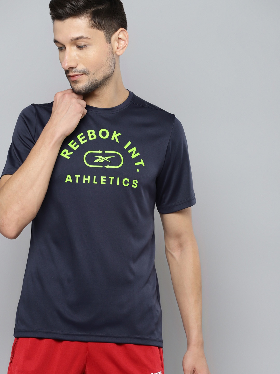

Reebok Men Navy Blue & Fluorescent Green Typography Printed Regular Fit T-shirt
