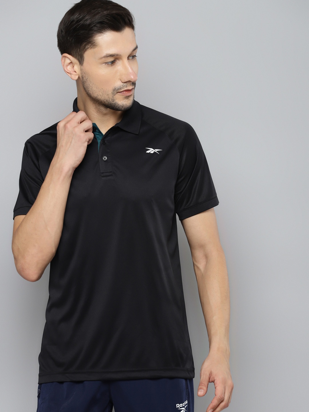 

Reebok Men Black Solid Polo Collar Speedwick T-shirt