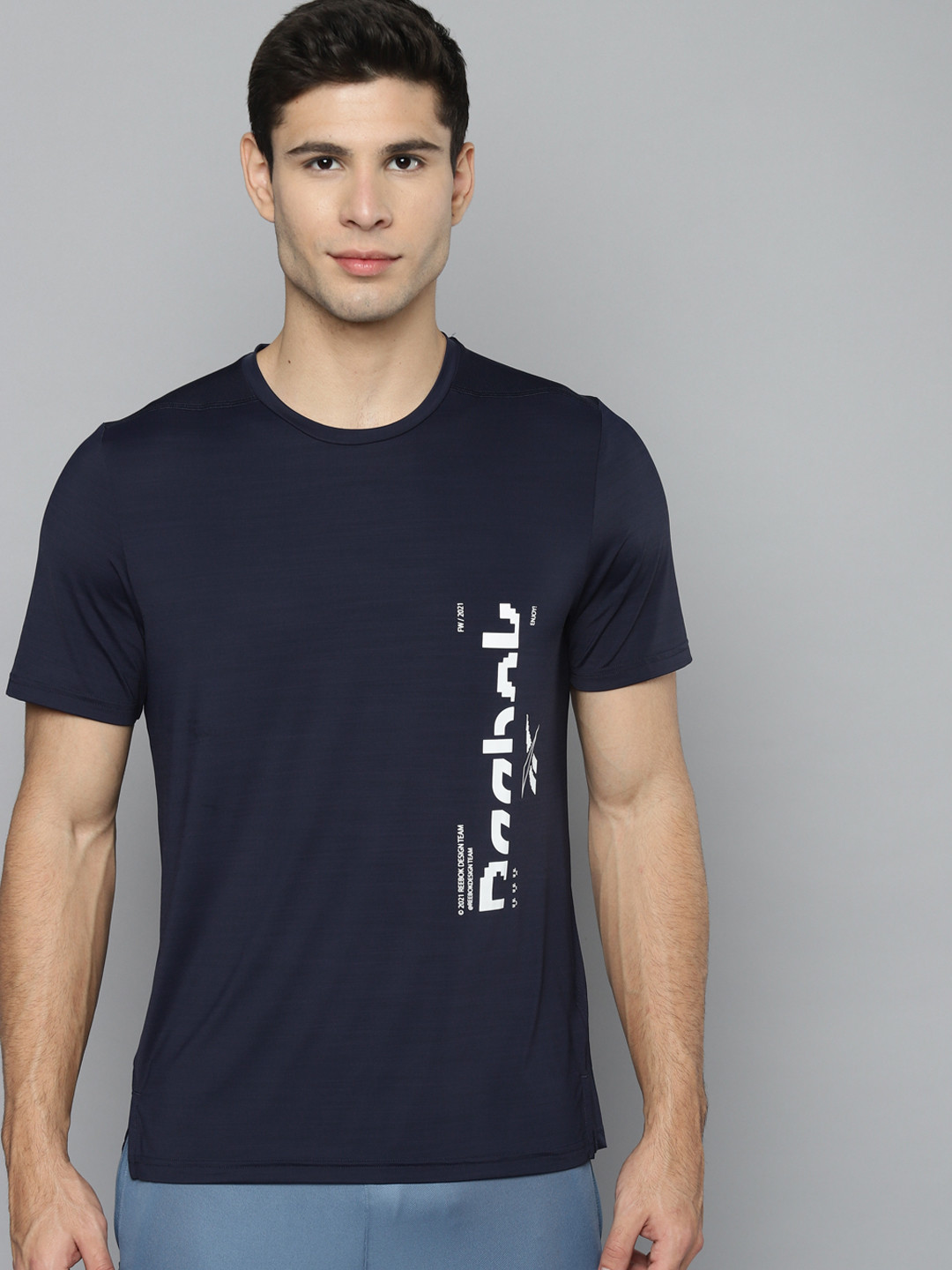 

Reebok Men Navy Blue & White Brand Logo Printed Activchill TS GRAPHIC Q4 T-shirt