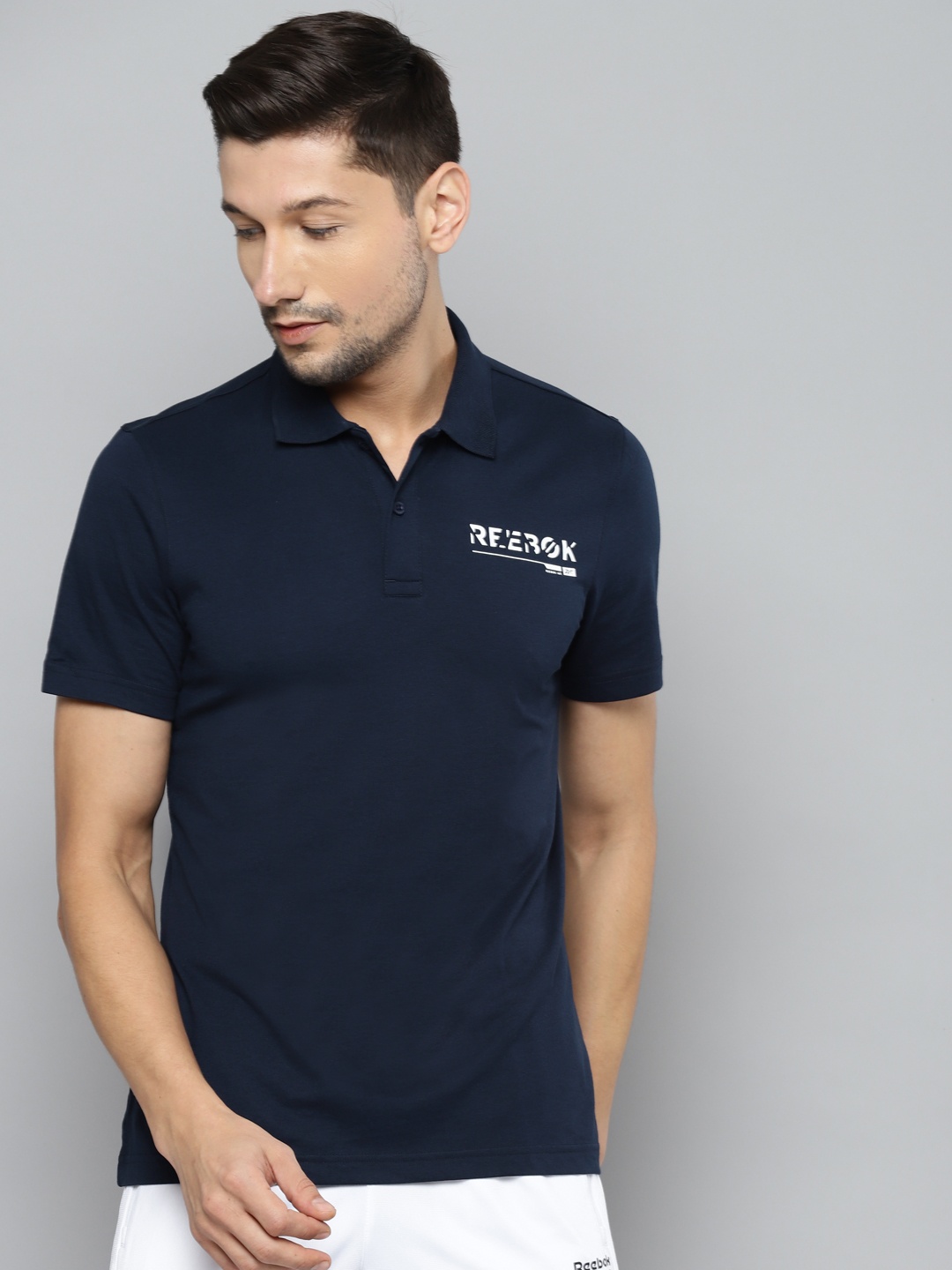 

Reebok Men Navy Blue Polo Collar T-shirt