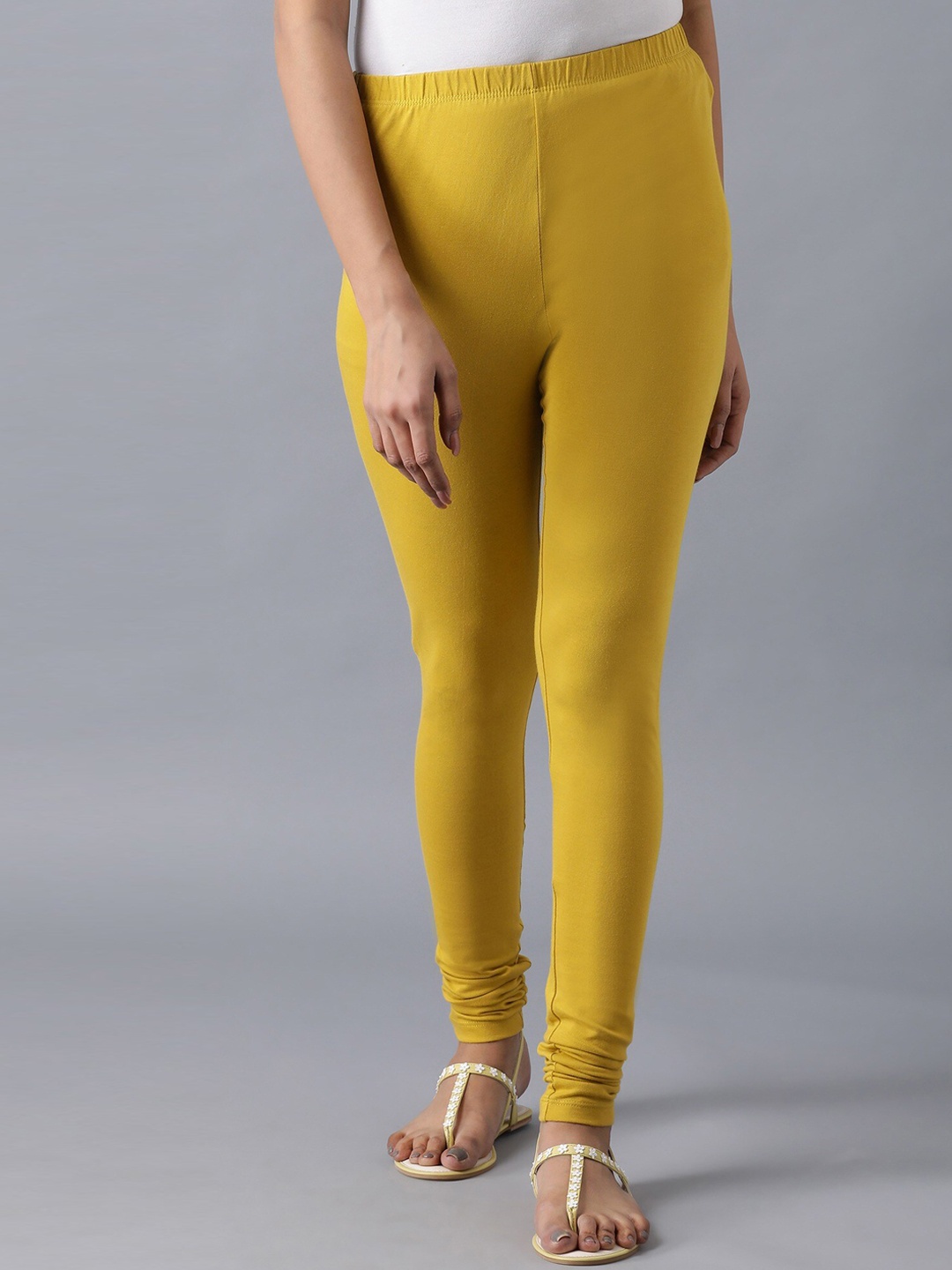

Elleven Women Yellow Solid Mid Rise Cotton Churidar