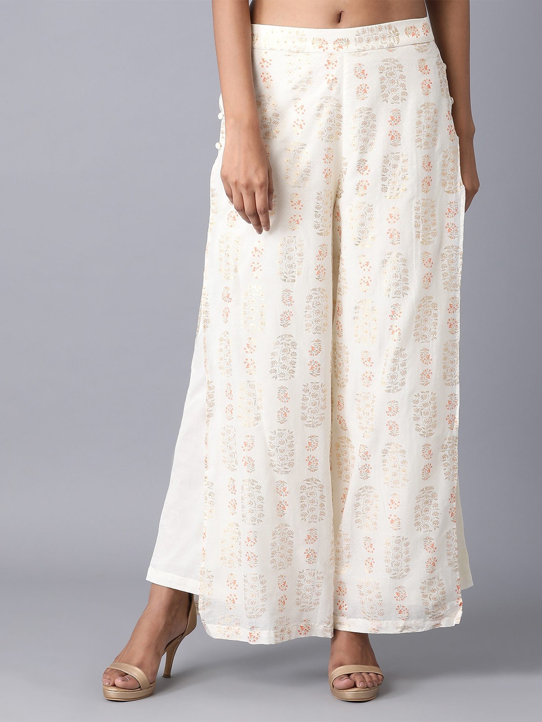 

elleven Women Off White & Orange Floral Printed Flared Palazzos
