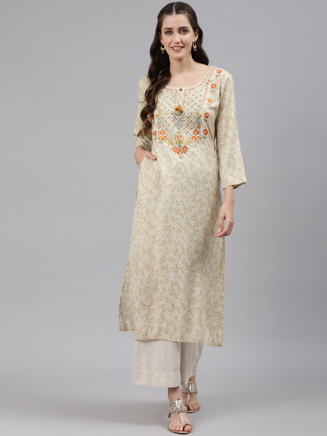 

Readiprint Fashions Women Cream-Coloured Ethnic Motifs Embroidered Kurta