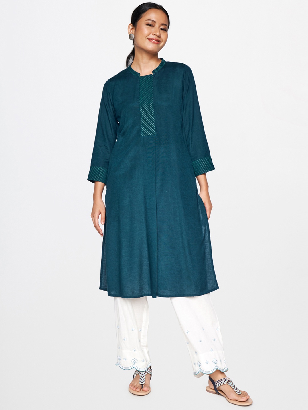 

Global Desi Women Teal Solid Kurta