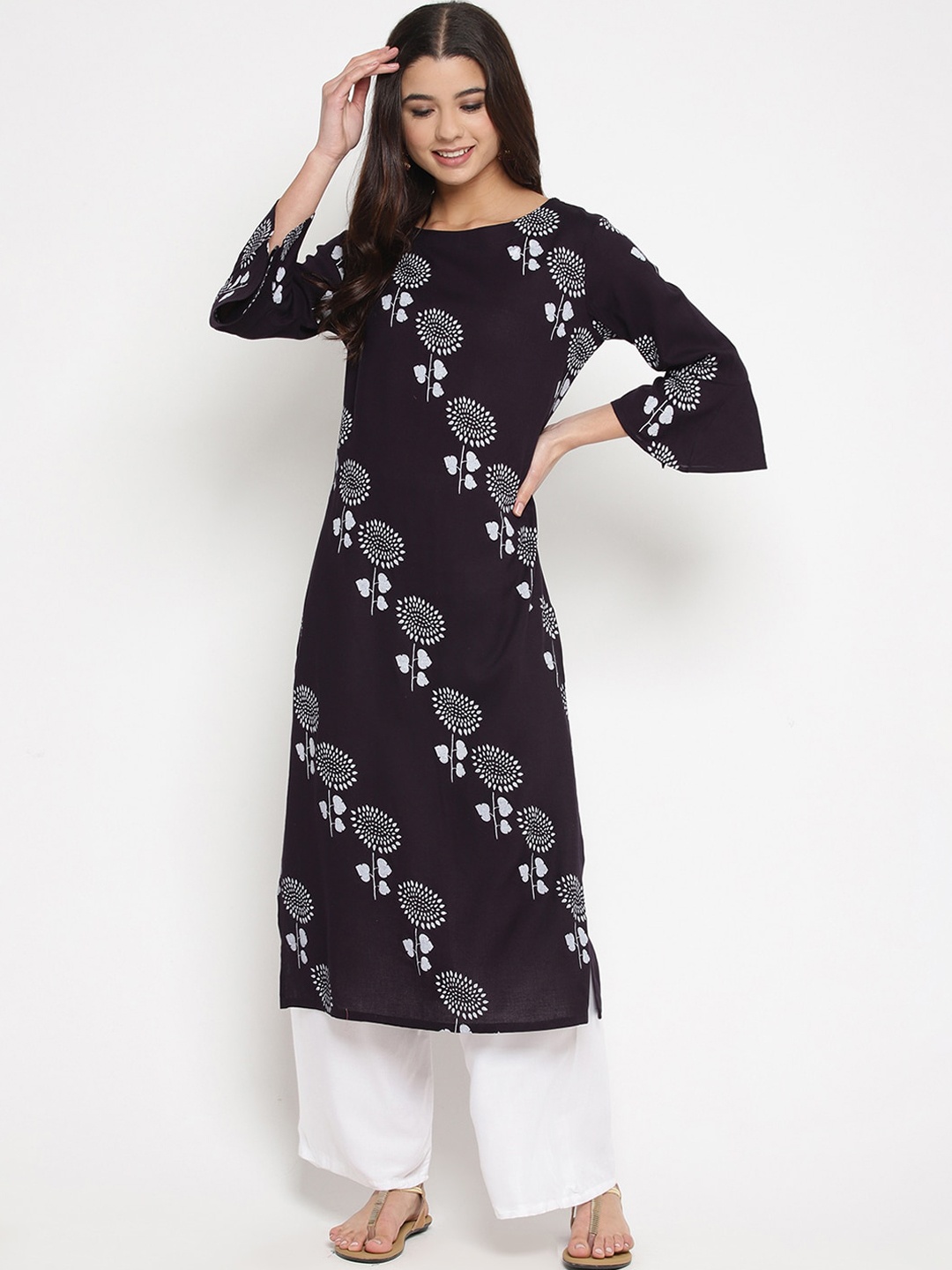 

Prakhya Women Black & White Floral Printed Regular Kurta with Palazzos