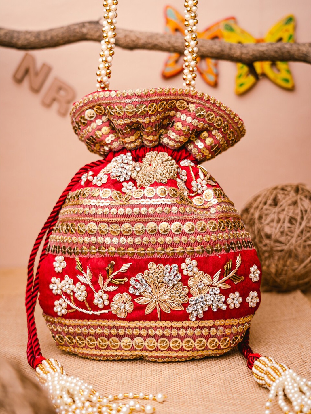 

NR By Nidhi Rathi Maroon & Gold-Toned Persia Embroidered Potli Clutch