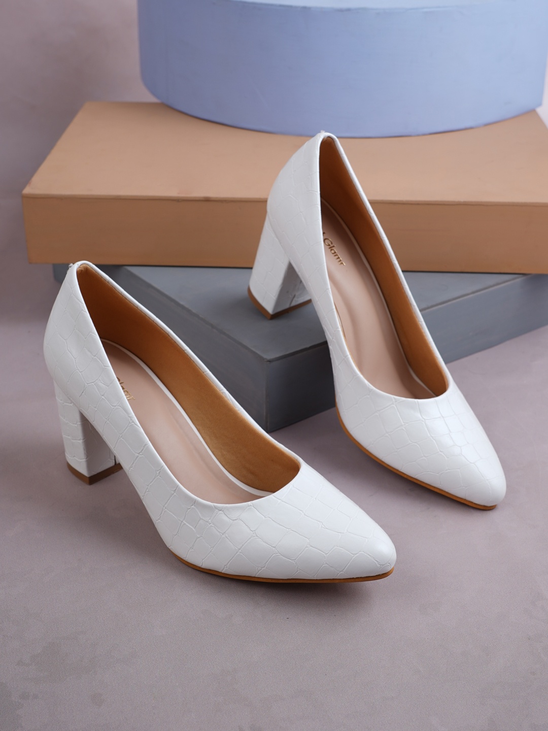 

Get Glamr White Textured Block Pumps