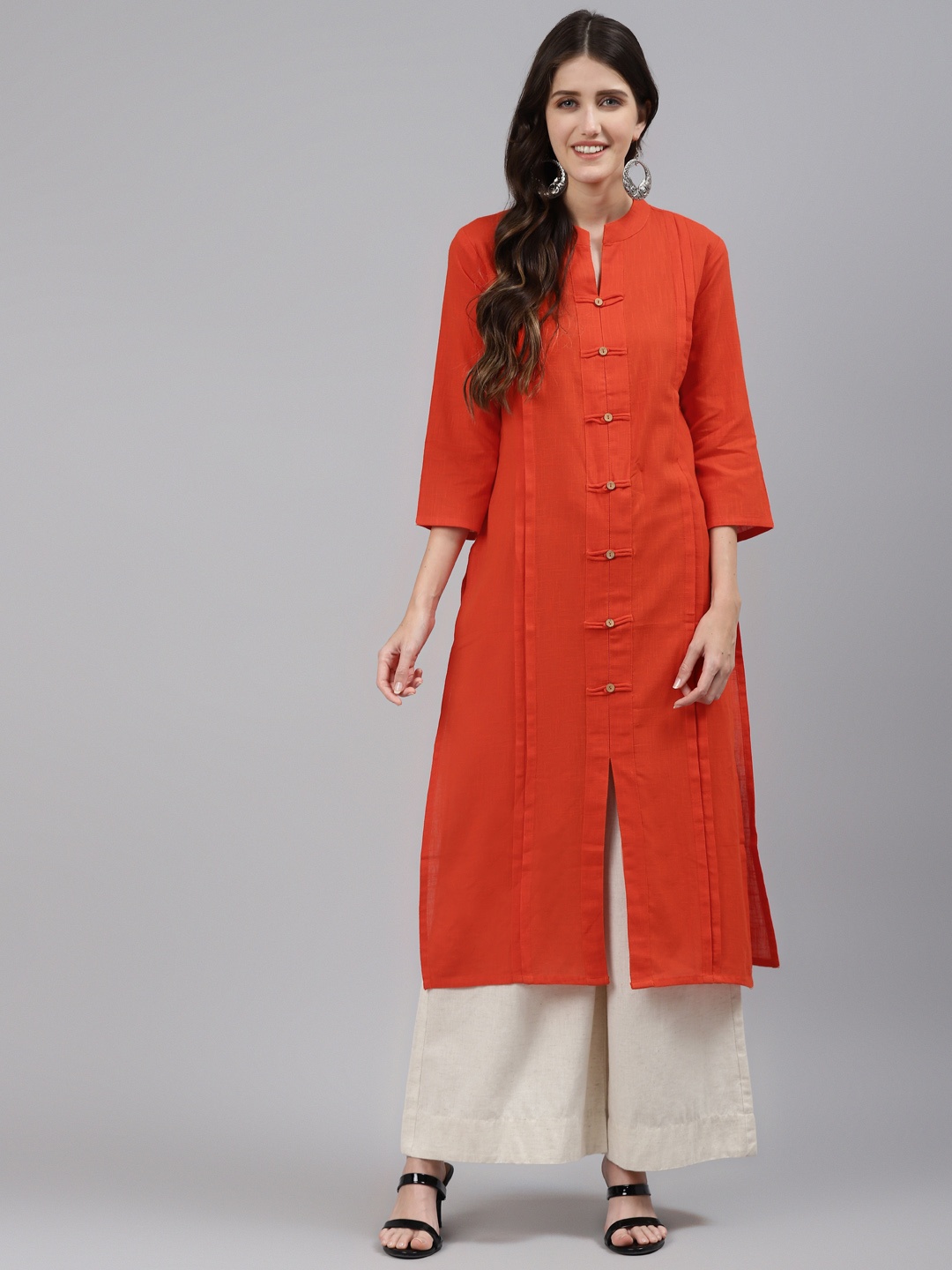 

Readiprint Fashions Women Orange Solid Pure Cotton Kurta With Multiple Slits