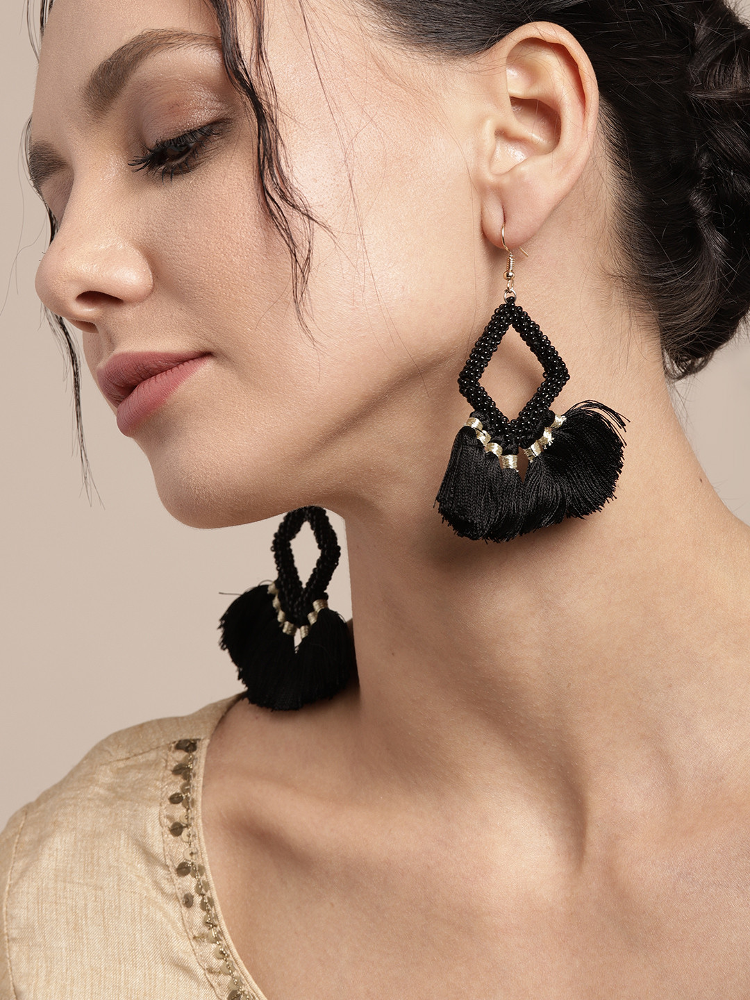 

Sangria Black & Gold-Toned Beaded Diamond Shaped Tasseled Drop Earrings