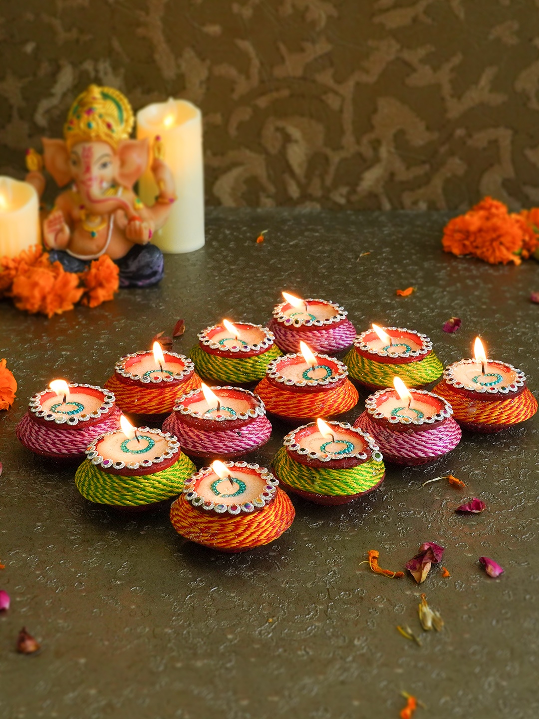 

TIED RIBBONS Multi Set of 12 Hand-Painted Wax Filled Terracotta Diwali Diyas