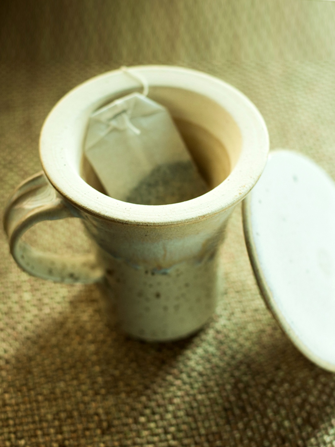 

ExclusiveLane Cream-Coloured Printed Handcrafted Tea Mug with Filter & Lid