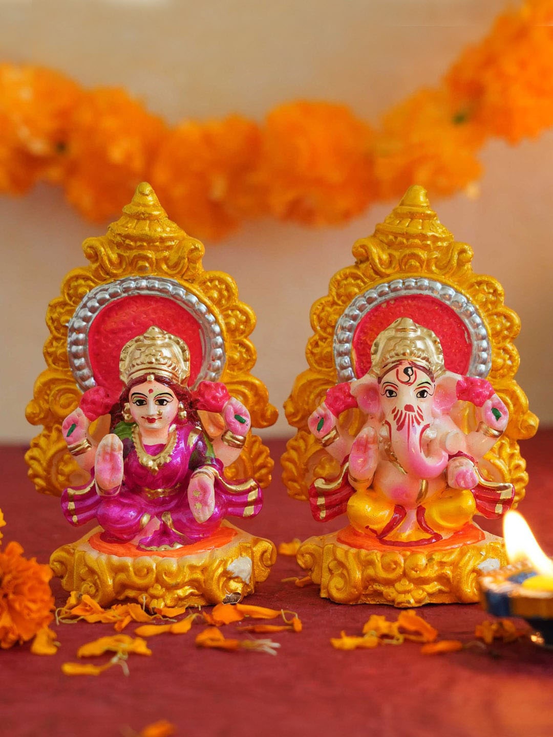 

TIED RIBBONS Set of 2 Gold-Toned & Orange Lord Laxmi Ganesha Idol Diwali Showpieces