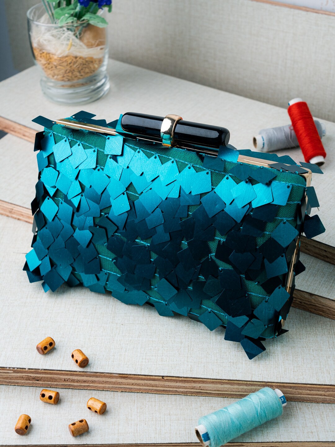 

NR By Nidhi Rathi Turquoise Blue & Gold-Toned Textured Box Clutch