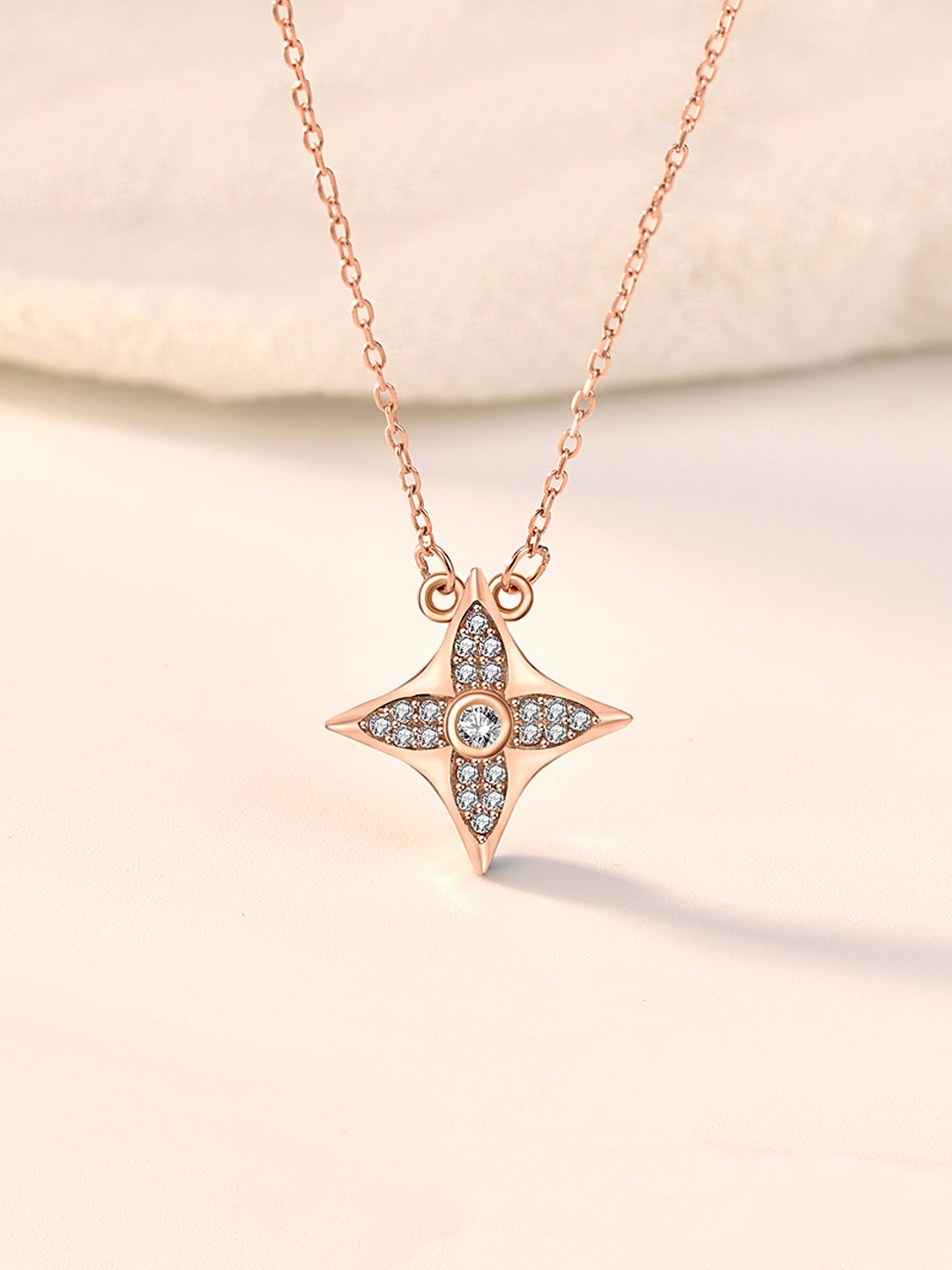 

Yellow Chimes 92.5 Sterling Silver Rose Gold-Plated White CZ-Studded Star-Shaped Pendant With Chain