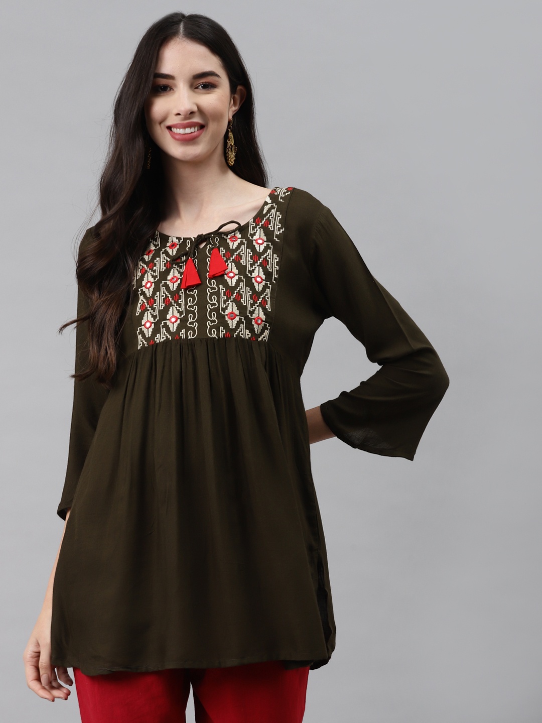 

HIGHLIGHT FASHION EXPORT Green Embroidered Tie-Up Neck Regular Top