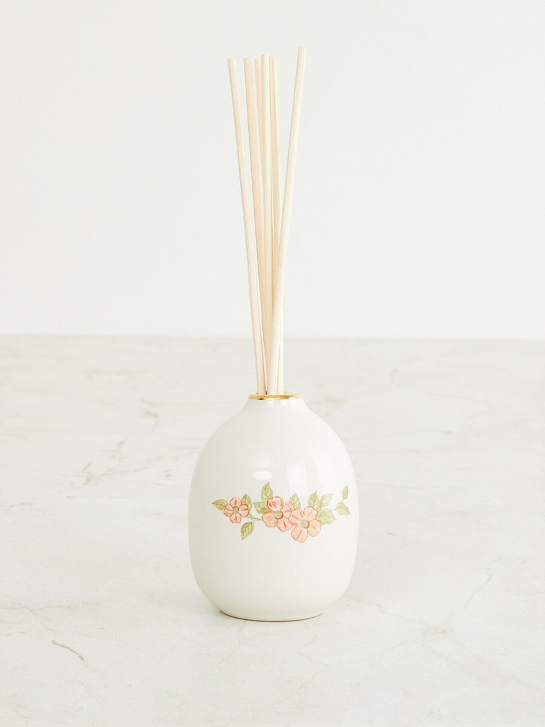 

Home Centre White & Orange Printed Ceramic Decal Reed Diffuser Pot With 6 Sticks