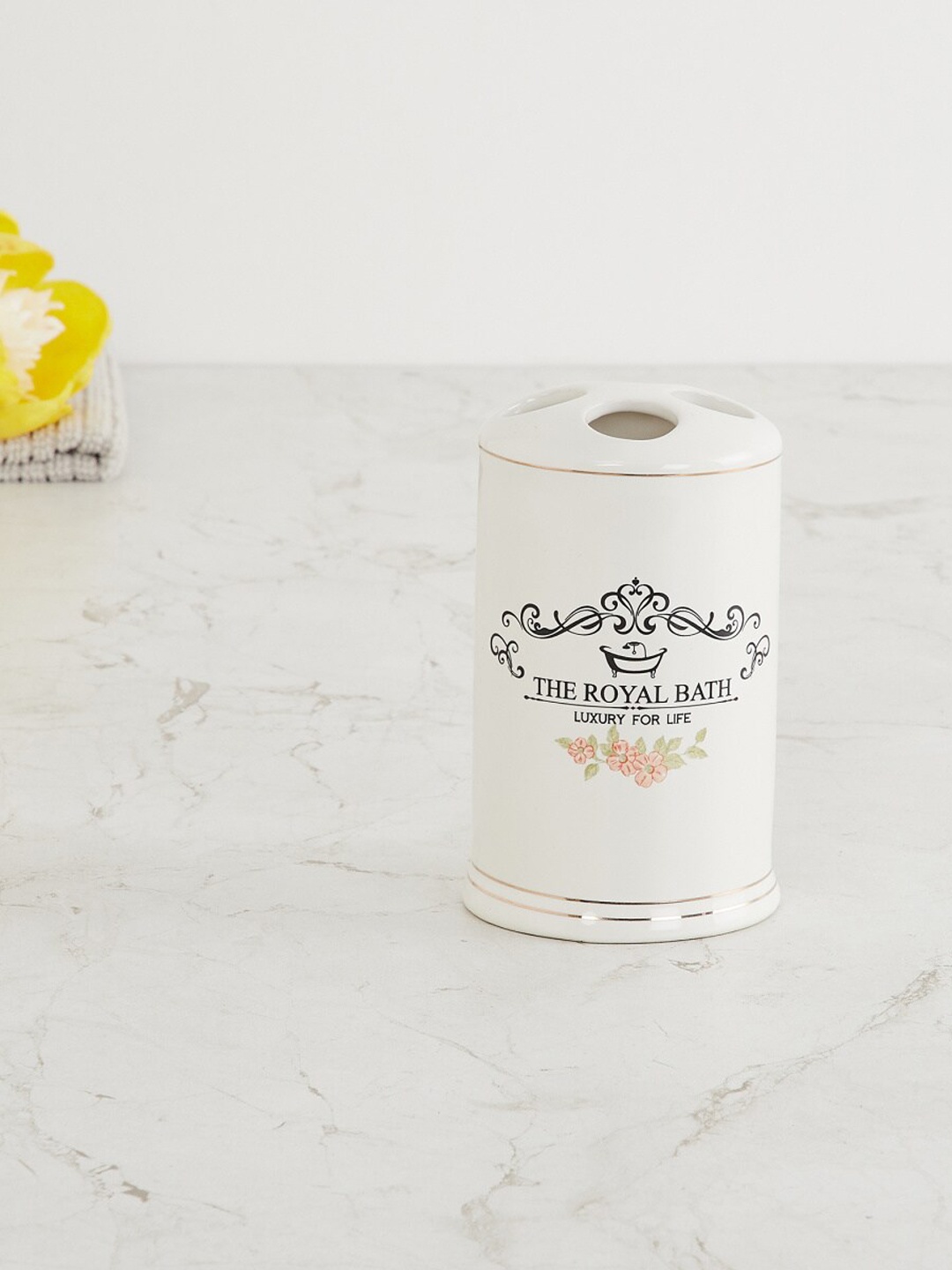 

Home Centre Off White & Black Printed The Royal Bath Ceramic Toothbrush Holder