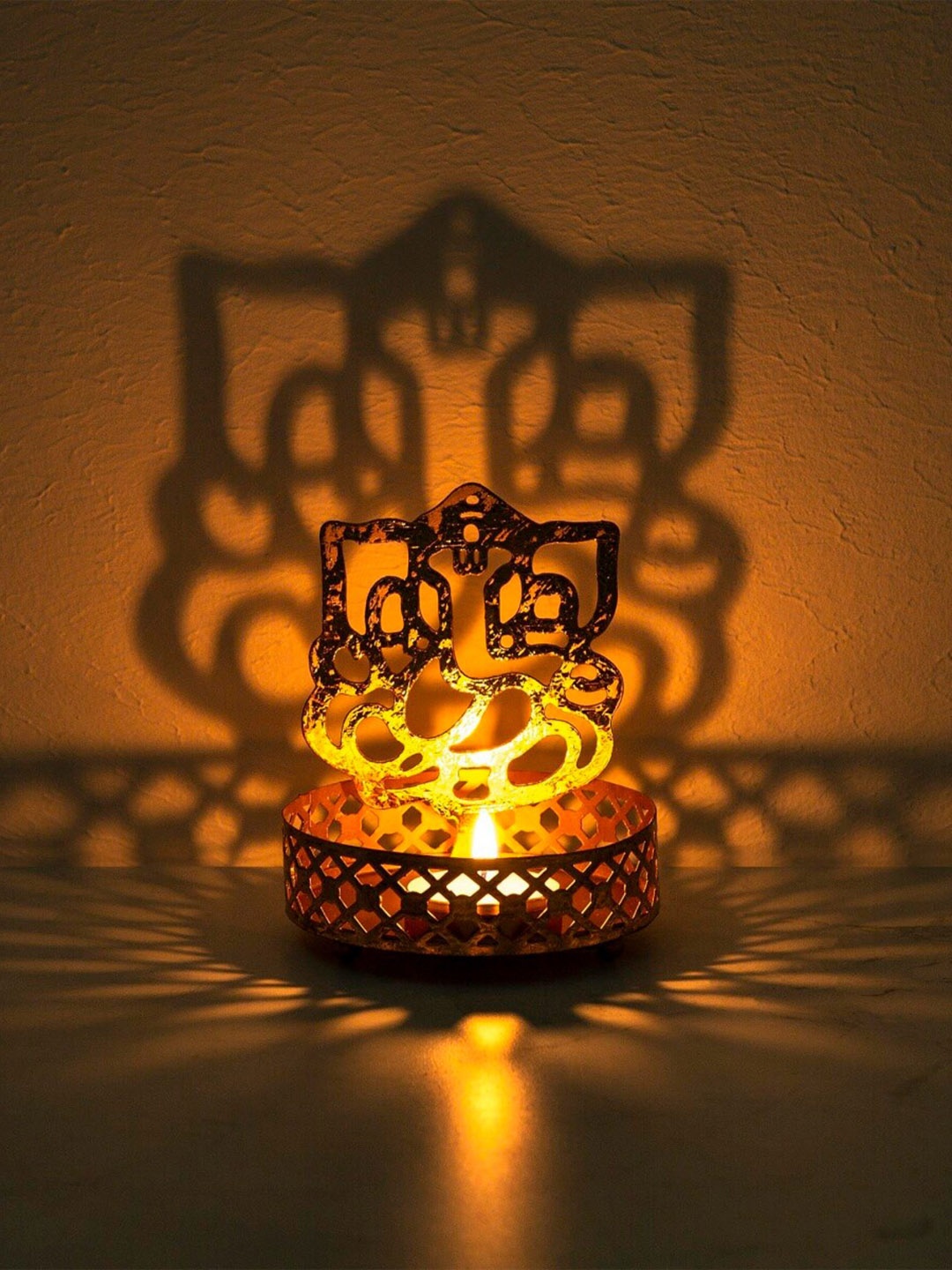 

Home Centre Gold-Toned Ganesha T-Light Holder With Base