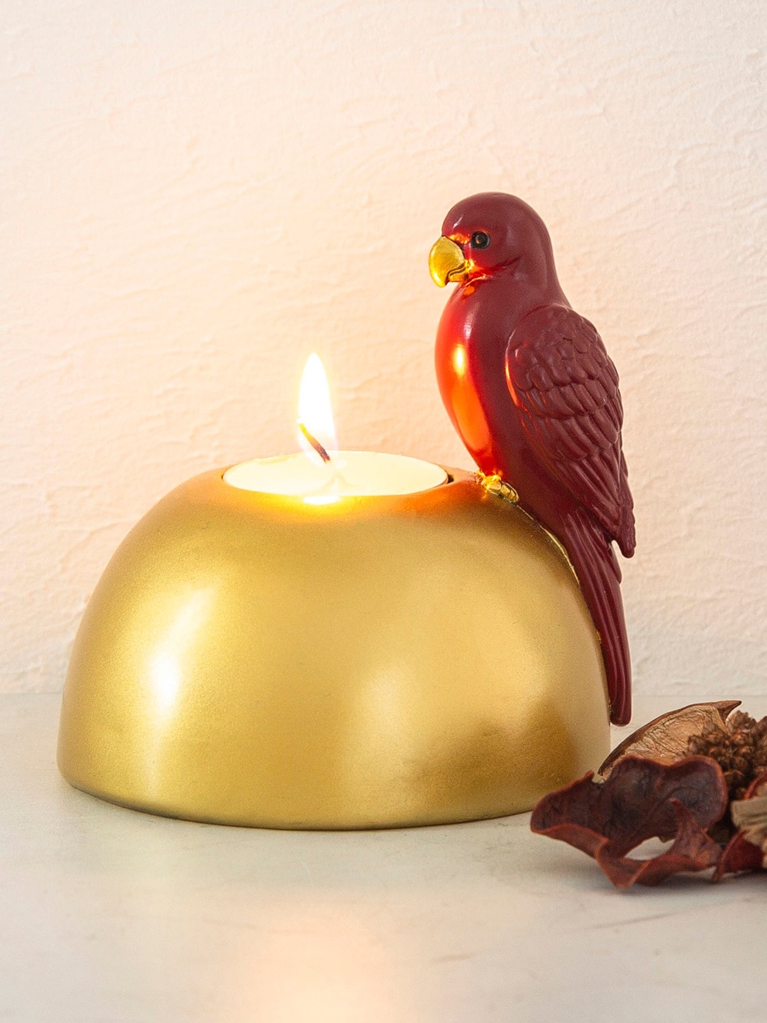 

Home Centre Gold-Toned & Red Candle Holder With Bird Accent