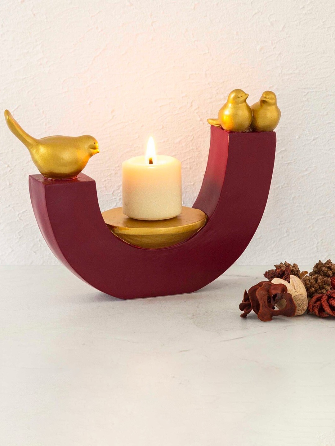 

Home Centre Maroon & Gold-Toned Candle Holder With Bird Accent