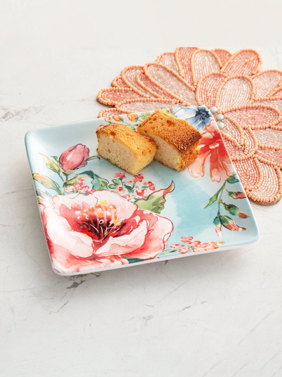 

Home Centre Turquoise Blue & Pink 1 Pieces Printed Stoneware Glossy Plate
