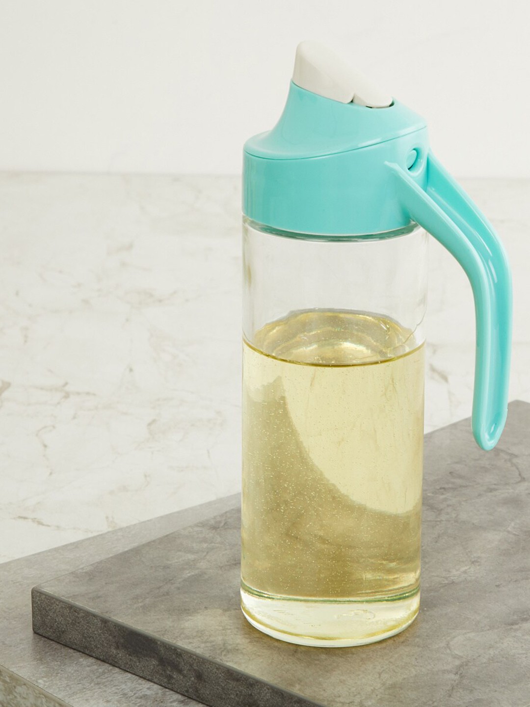 

Home Centre Transparent & Blue Solid Pamolive Glass Oil Jar With Lid
