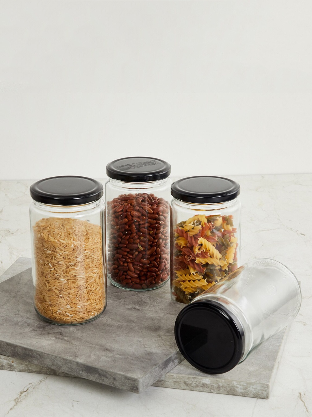 

Home Centre Set Of 4 Transparent & Black Solid Tuscany Glass Container With Lid 750 Ml