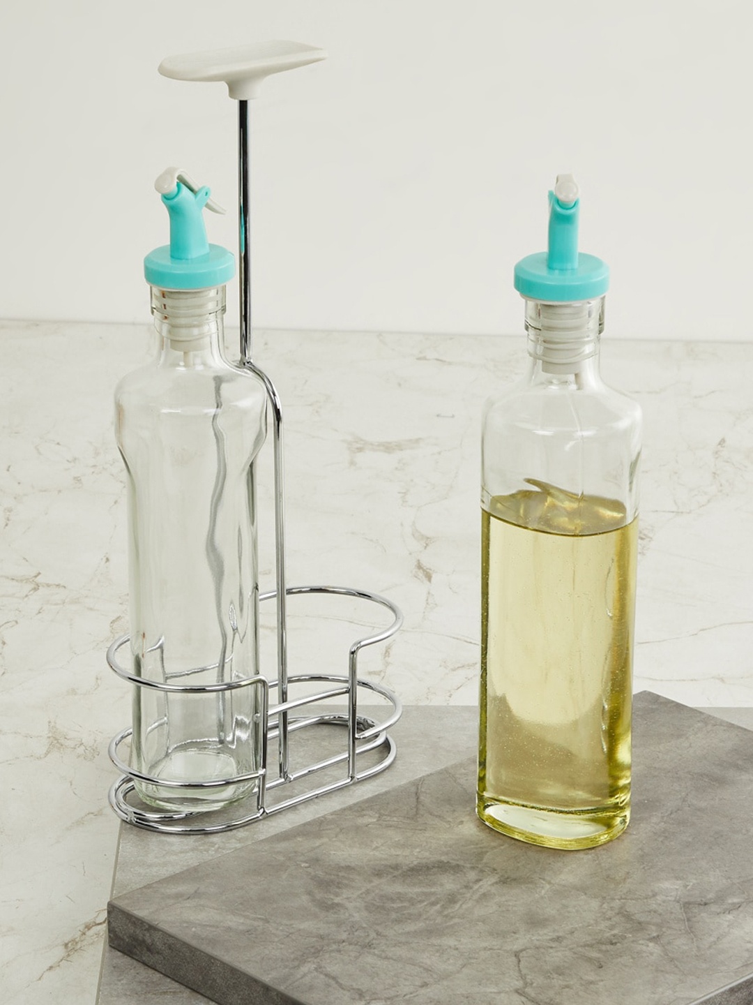 

Home Centre Transparent & Blue Set of 2 Oil & Vinegar Bottle With Stand 350ml