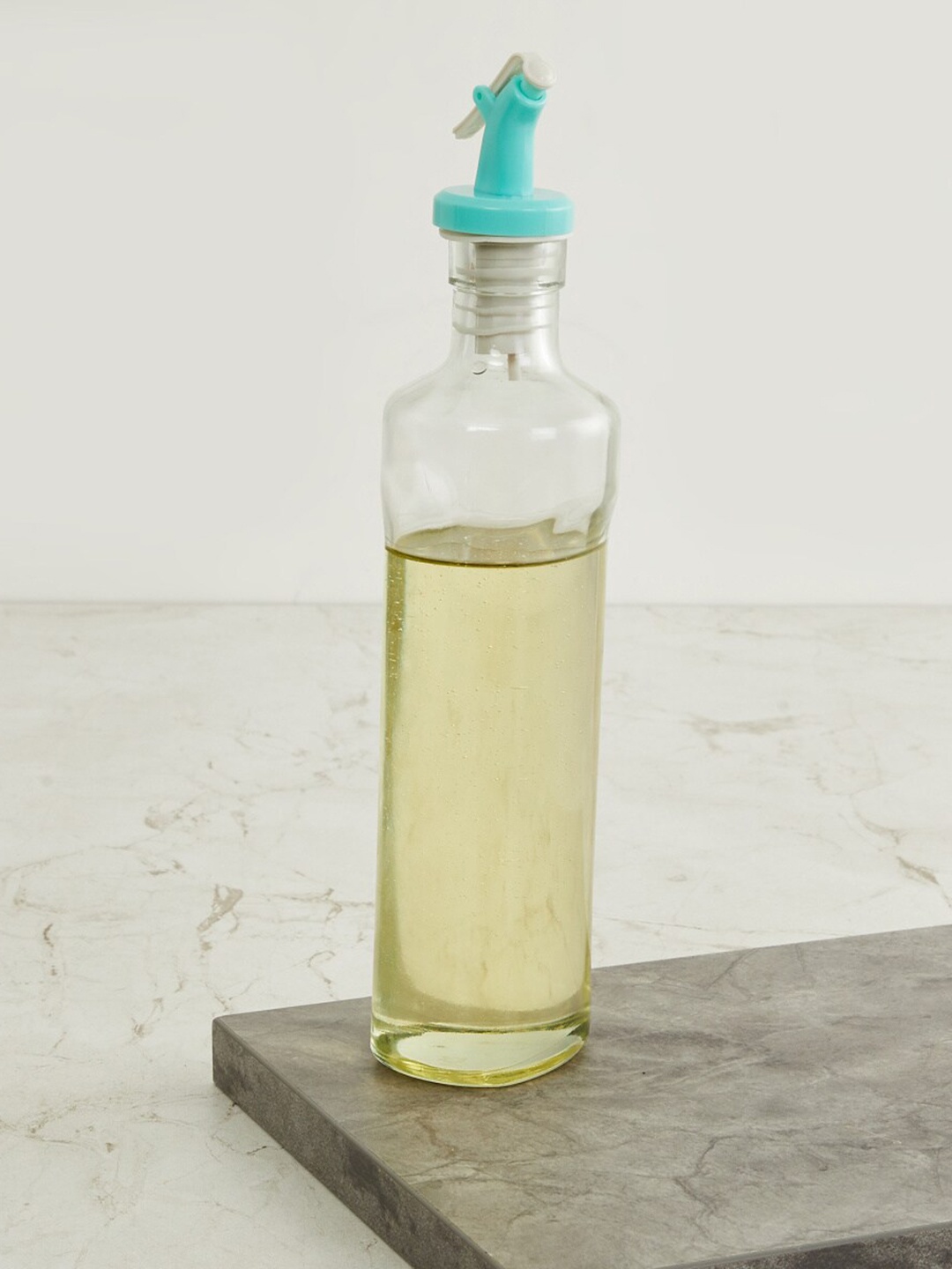 

Home Centre Transparent & Blue Solid Pamolive Oil Bottle